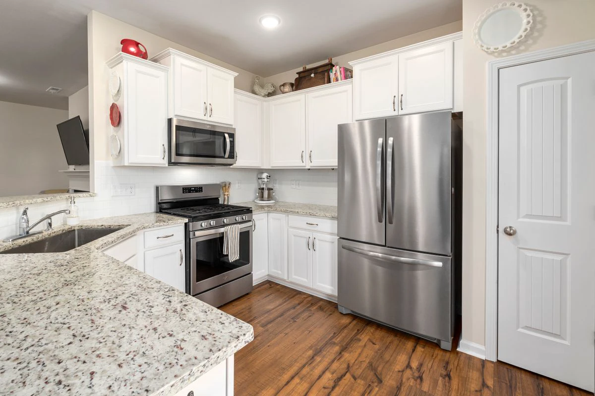Pre-assembled kitchen cabinets installed in a bright kitchen
