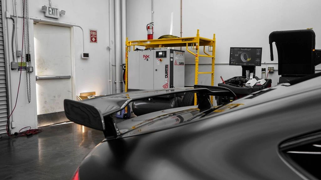 Build Bay 3 — a K-series engine mid-build with Garrett turbocharger and manifold mounted.